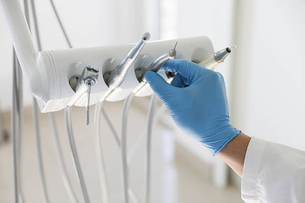 Professional Emergency Dentist technician working in Helmetta, NJ